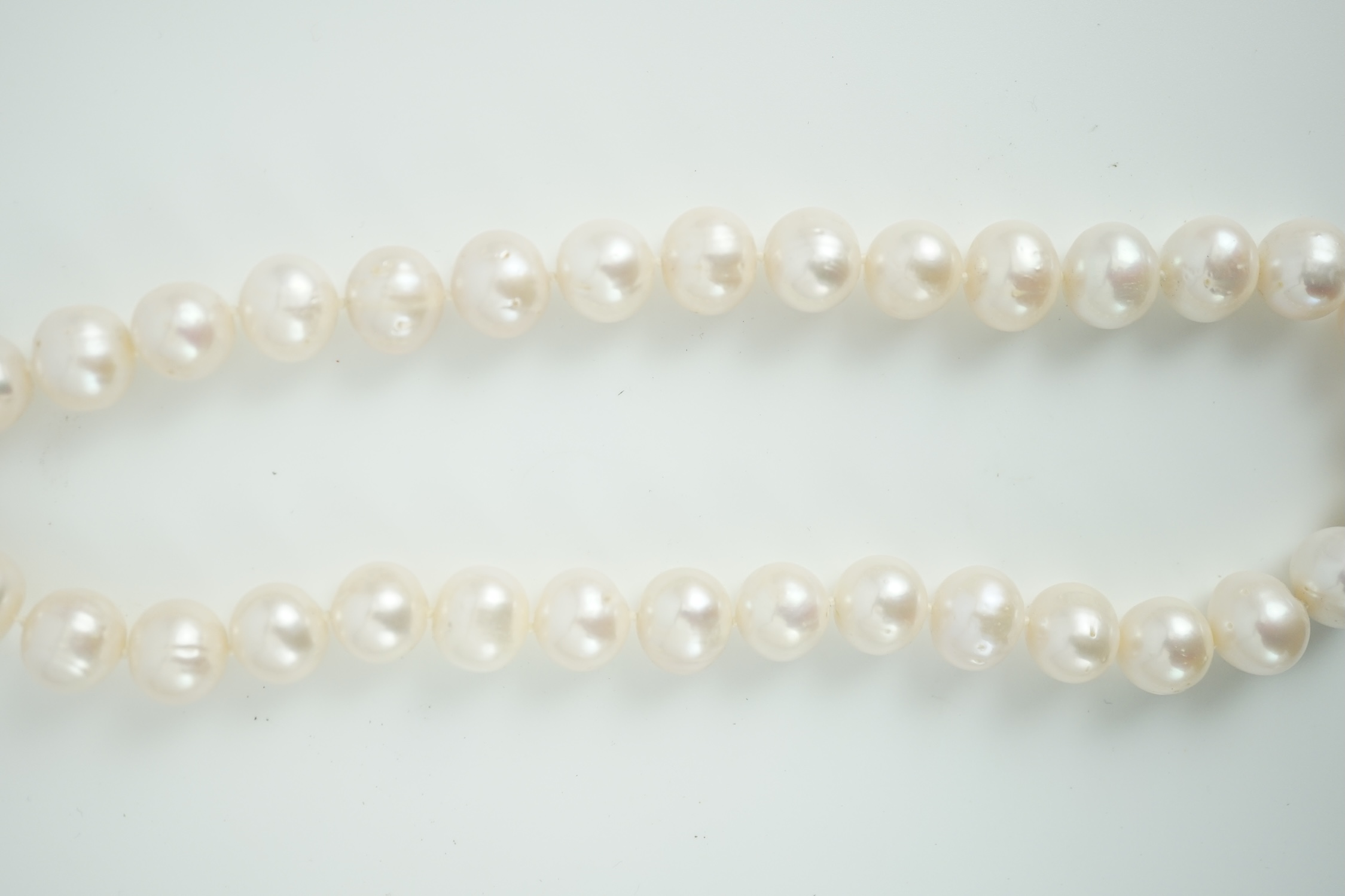 A single strand South Sea? cultured pearl necklace, with 14k yellow metal clasp, 44cm